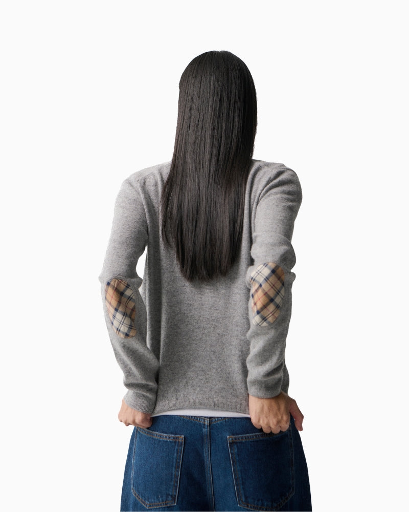 Detailed view of ribbed hem and sleeve cuff on grey wool-cotton Barbour knit