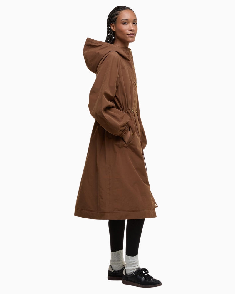 Side profile of Barbour Sidney waterproof parka showing drawcord waist detail