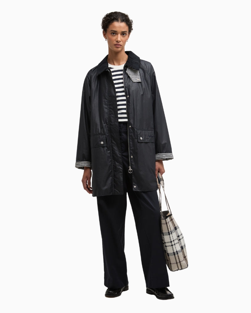 Woman wearing Barbour Wren wax jacket navy outdoor – Áines Boutique