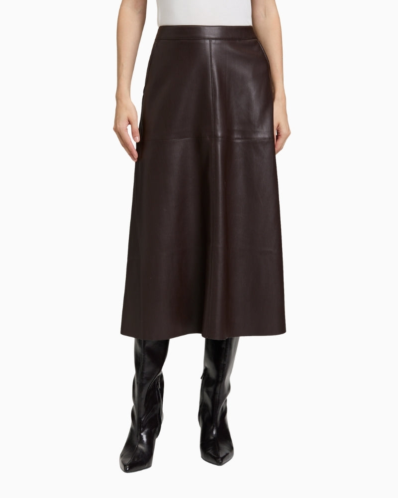Front view of Betty Barclay faux leather A-line skirt with slash pockets and midi length