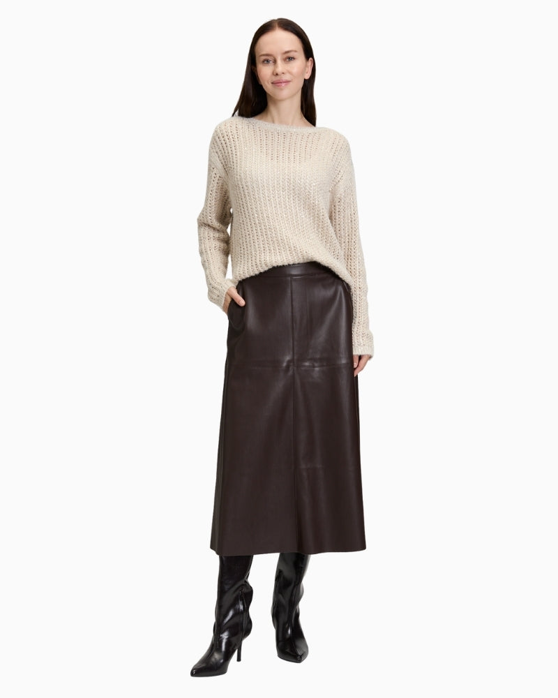 Front view of Betty Barclay faux leather A-line skirt with slash pockets and midi length