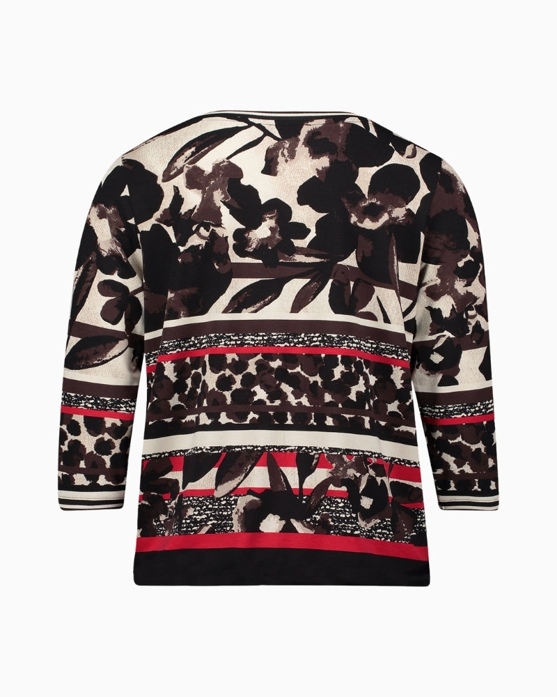 Back of jersey top showing figure‑skimming fit in soft floral pattern