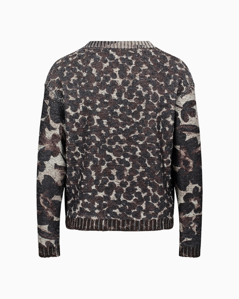 Back view of casual chunky knit showing floral texture and hip-length fit