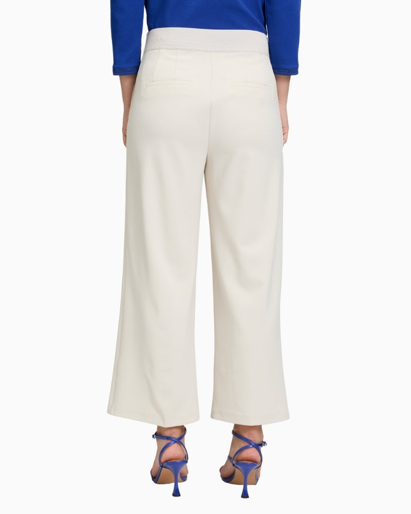 Back view of ¾ length wide-leg trousers showing relaxed drape and cropped fit