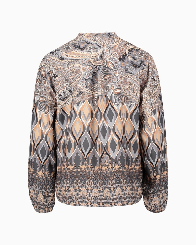 Back view of figure-skimming blouse with long sleeves and hip-length shape