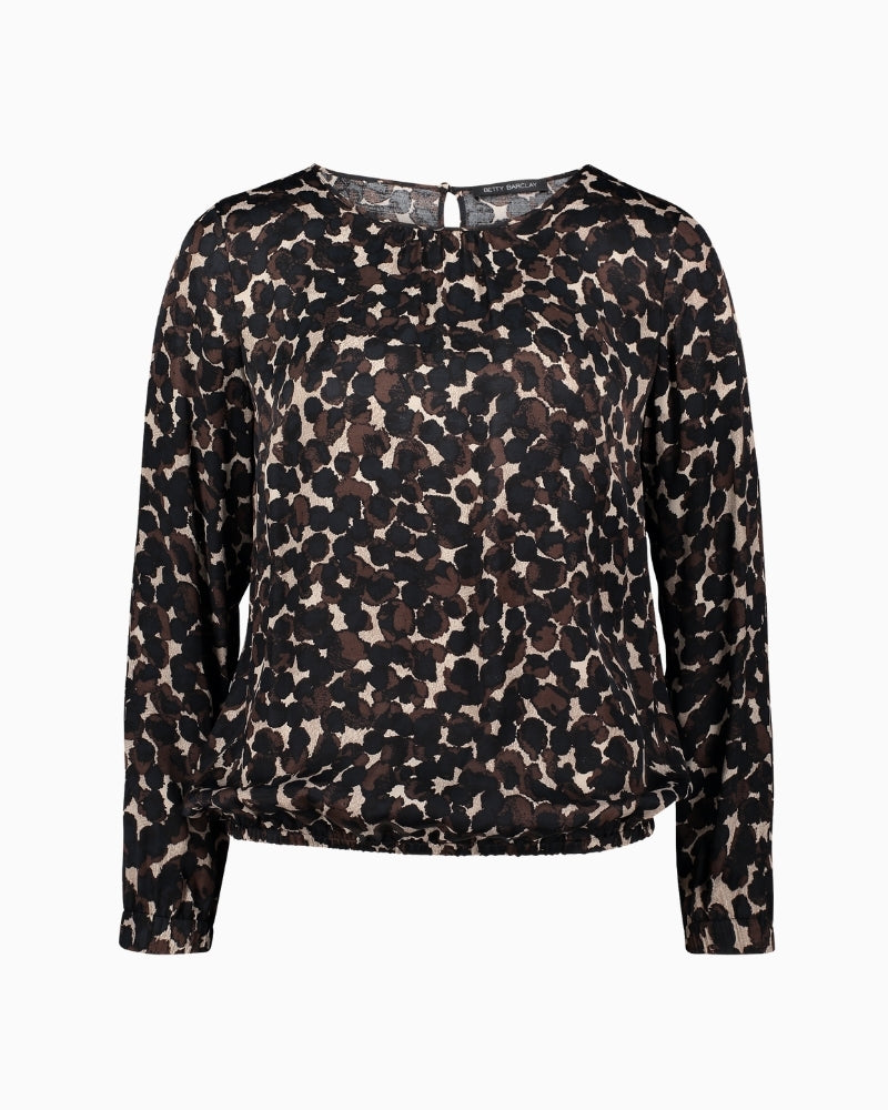 Front view of Betty Barclay polka dot overblouse with round gathered neckline and long sleeves