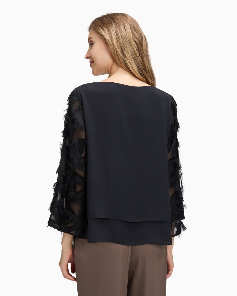 Back view of plain coloured overblouse with long sleeves