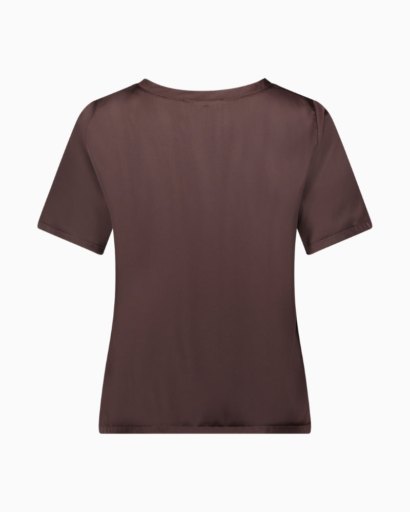 Back view of satin blouse showing figure-skimming shape and fastening detail