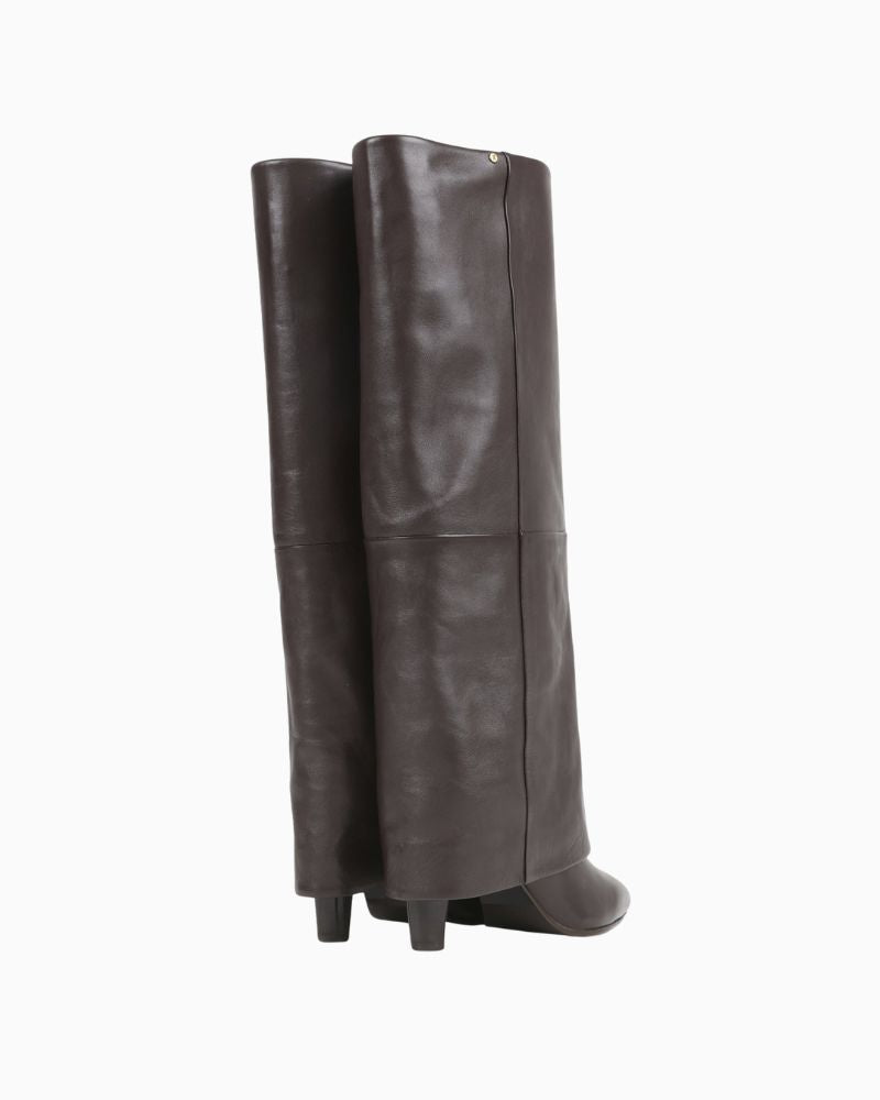 Back of Tall brown leather skirt boots by BRONX with banana heel