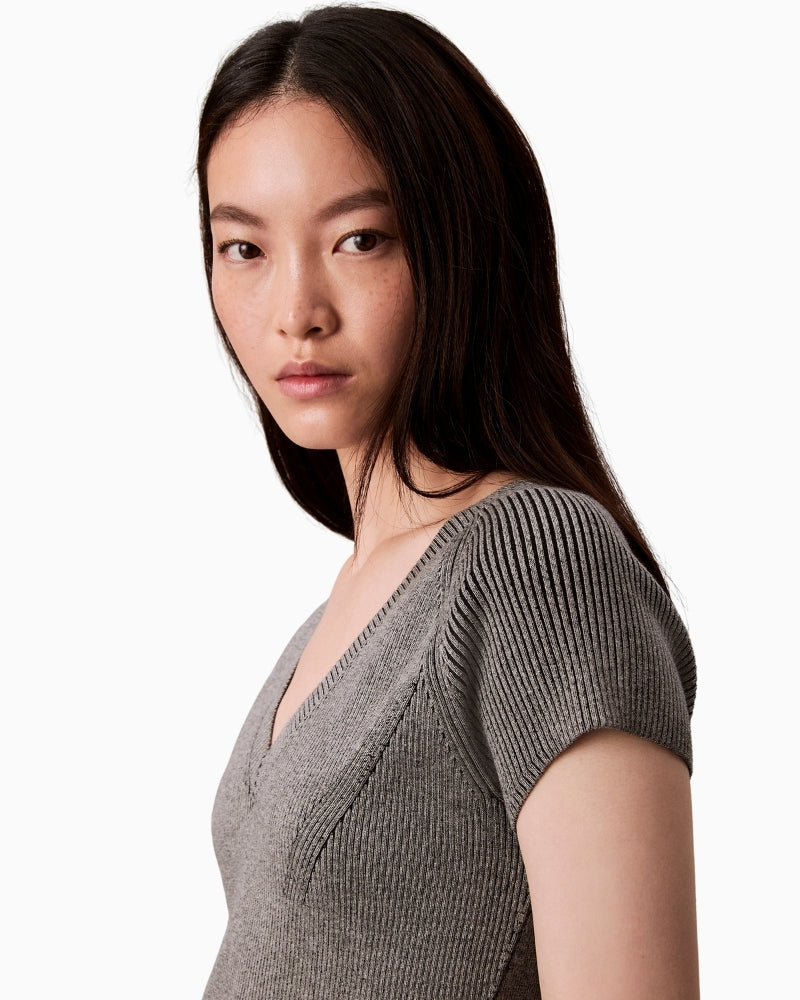 Close-up of snowy plaited knit texture in viscose blend