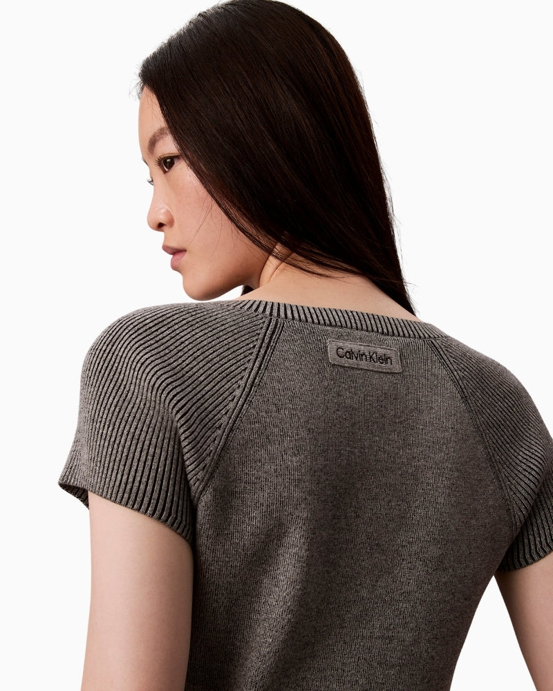 Close-up of snowy plaited knit texture in viscose blend