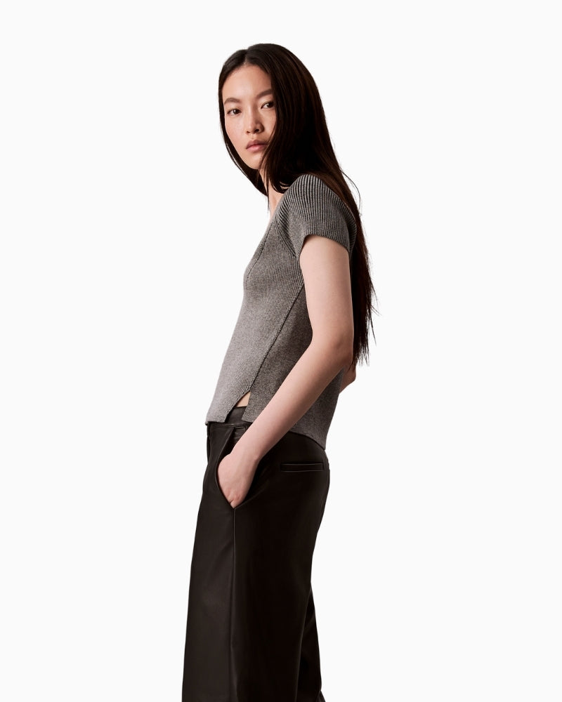 Side profile of grey sleeveless crew neck sweater by CK Jeans