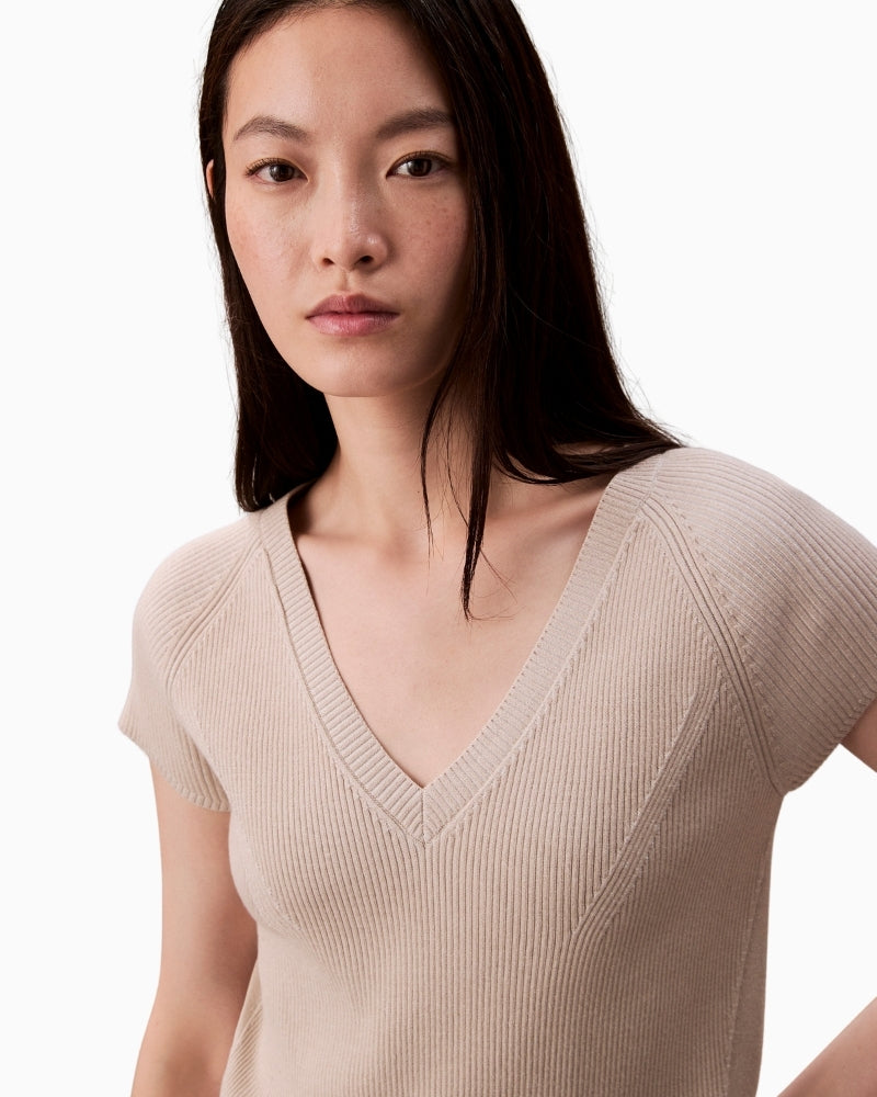 Close-up of snowy plaited knit texture in viscose blend