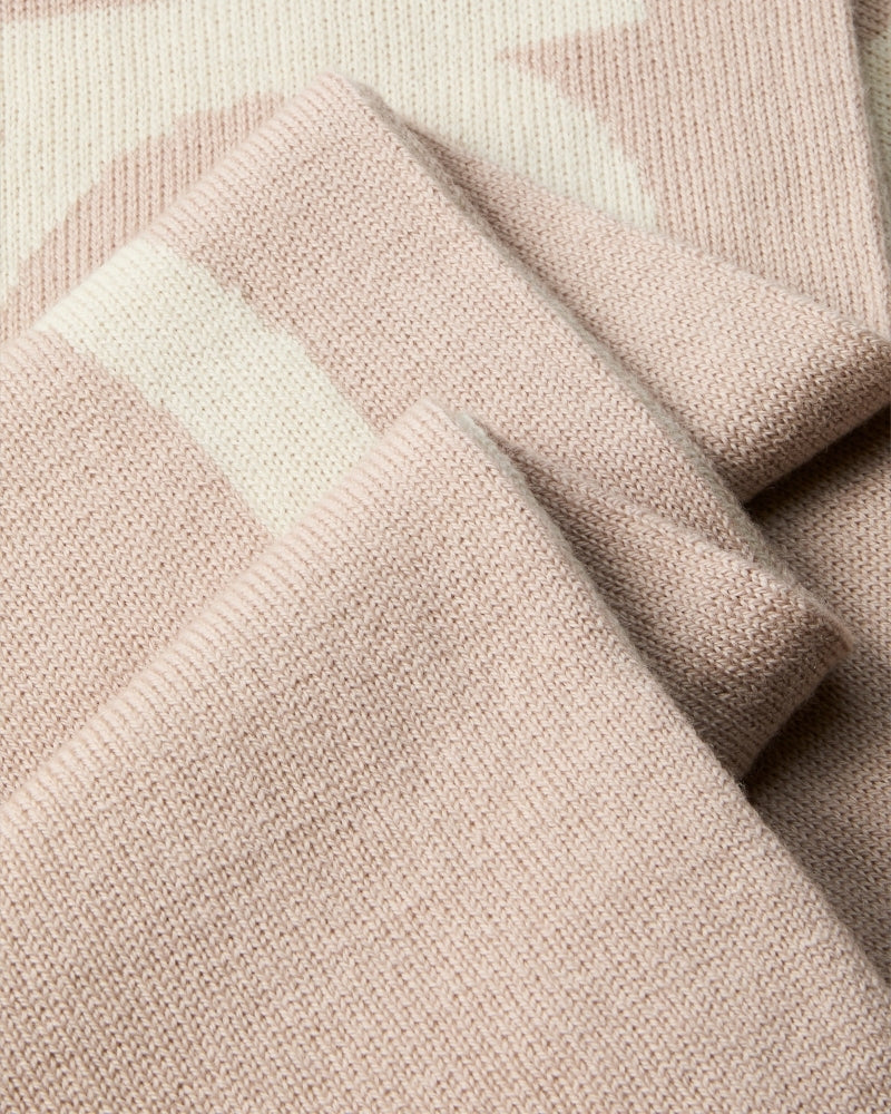 Close-up of CK logo on beige and contrasting tone scarf