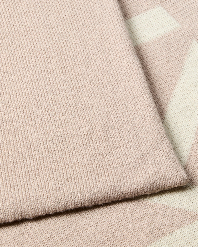 Close-up of CK logo on beige and contrasting tone scarf