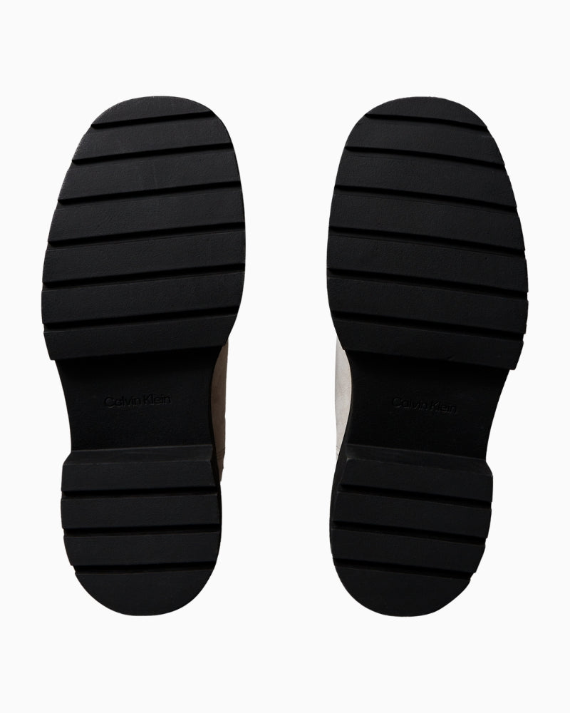 Back or angle shot highlighting tab and chunky tread