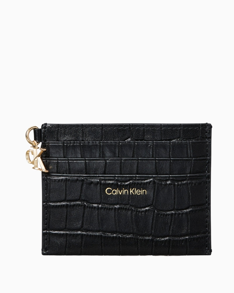Front view of Calvin Klein black croc‑embossed leather 6‑card case