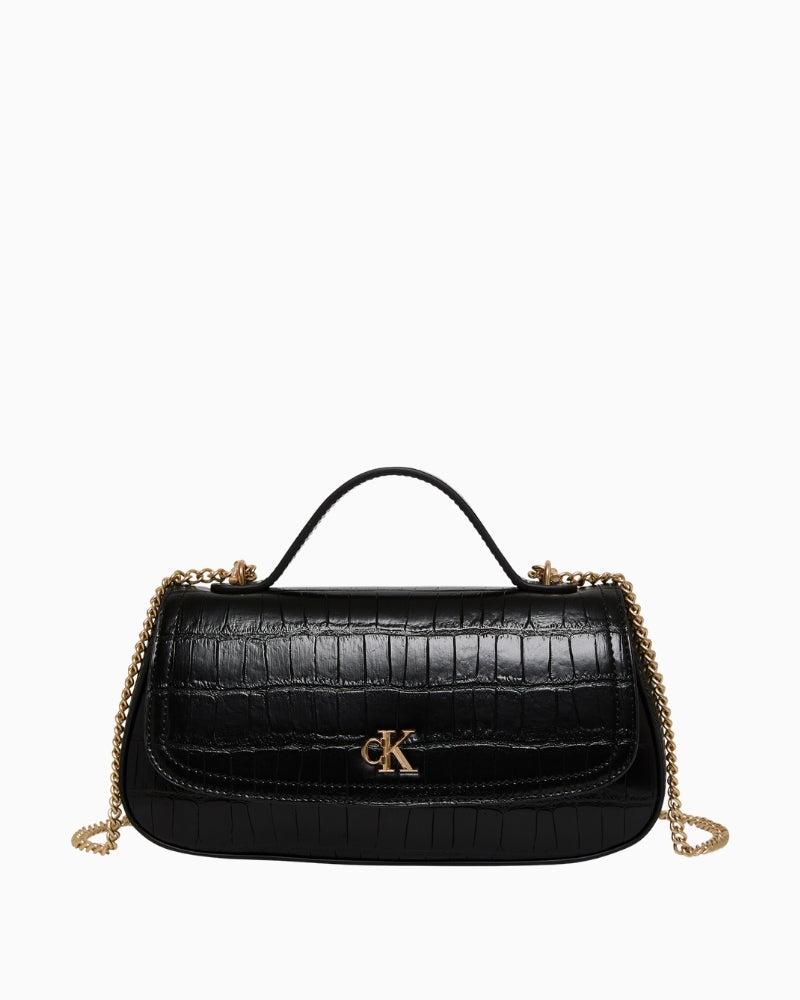 Ergonomic front view of Calvin Klein black croc top-handle bag with chain accent