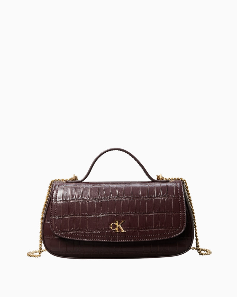 Front view of brown Calvin Klein croc top handle bag with chain strap