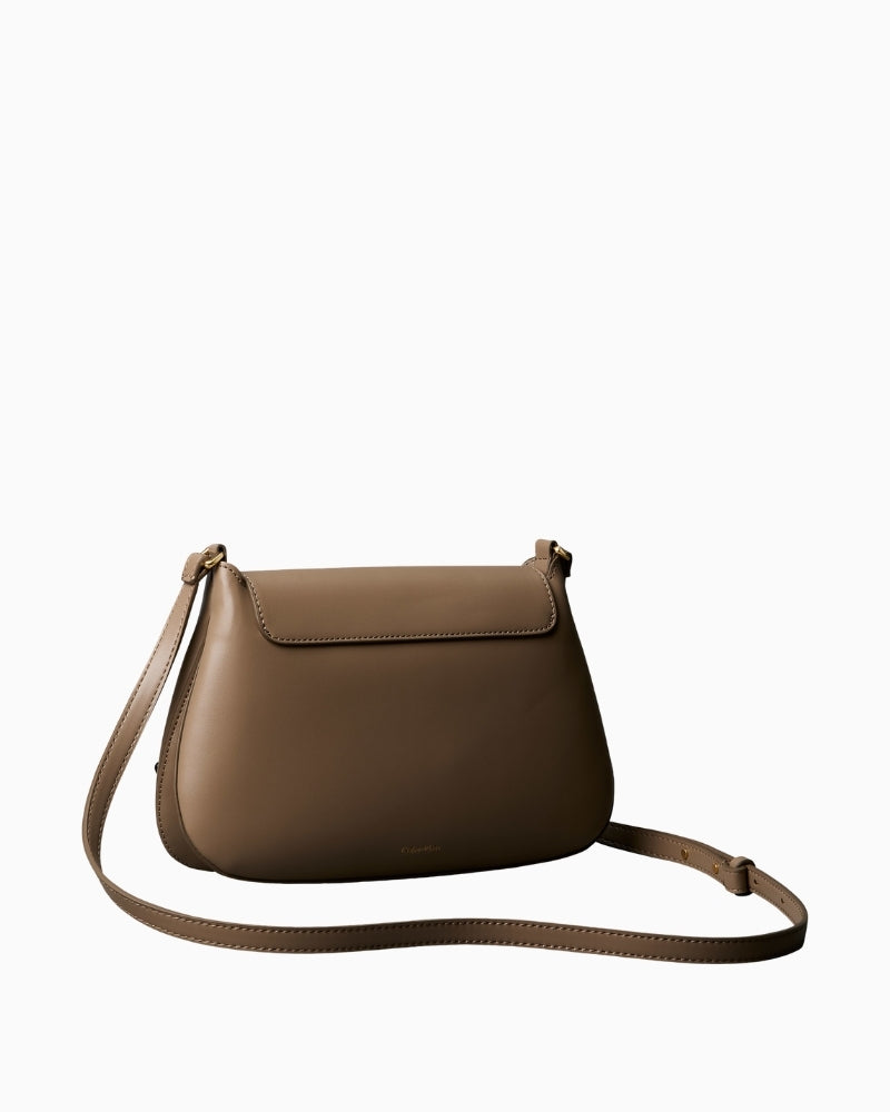 Calvin Klein taupe crossbody bag angled side view – Áines Boutique