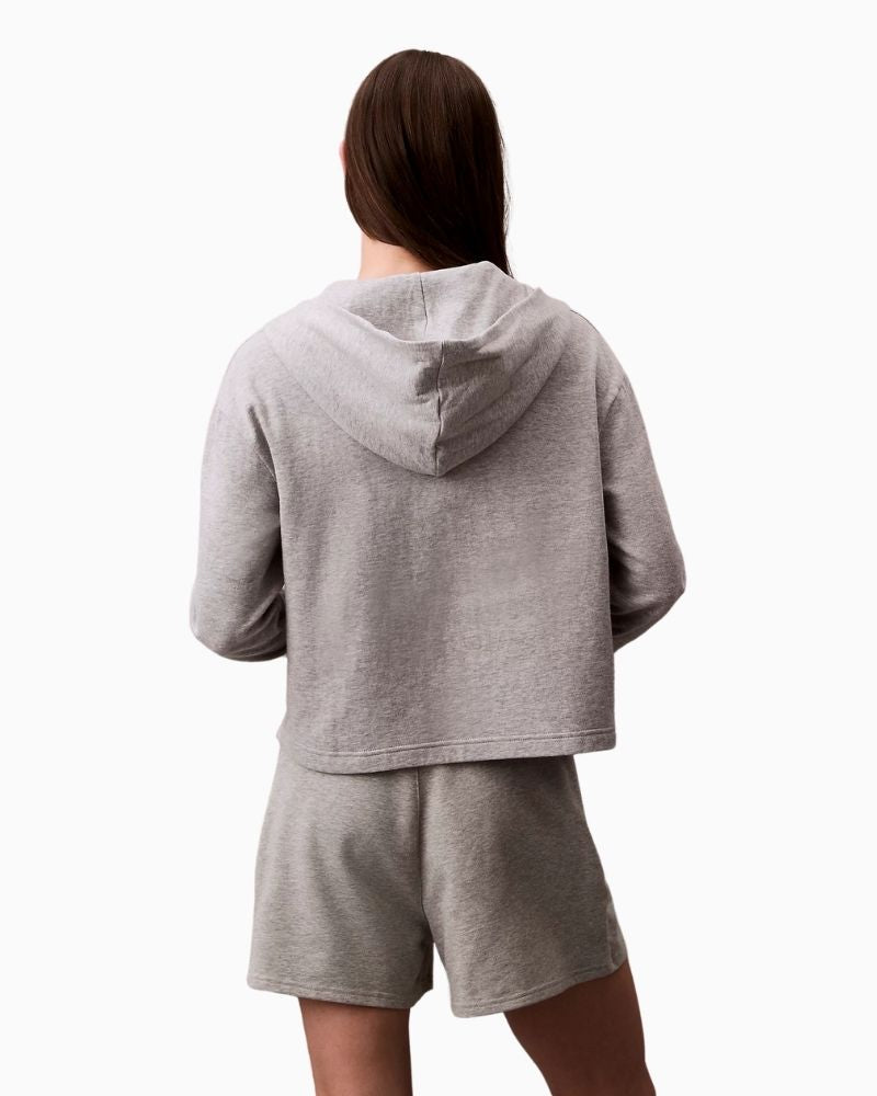 Back view of Calvin Klein hoodie showing relaxed fit and ribbed cuffs