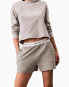 Close-up view of Calvin Klein lounge shorts showing soft terry fleece fabric and pockets