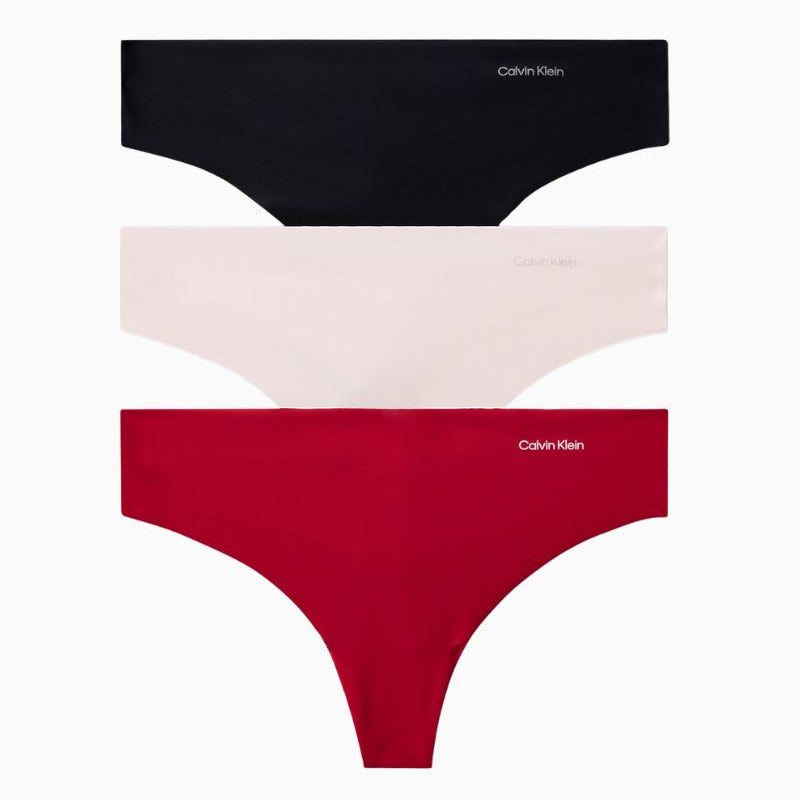 Calvin Klein Invisibles thong 3-pack in red, nude, and black with seamless laser-cut edges