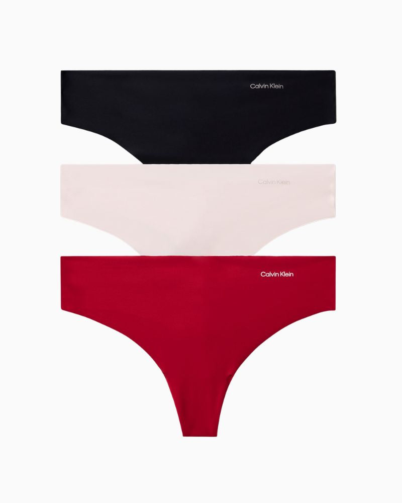 Calvin Klein Invisibles thong 3-pack in red, nude, and black with seamless laser-cut edges