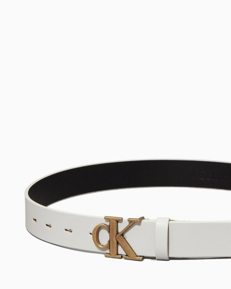 Close-up of Calvin Klein monogram buckle on soave cow split leather