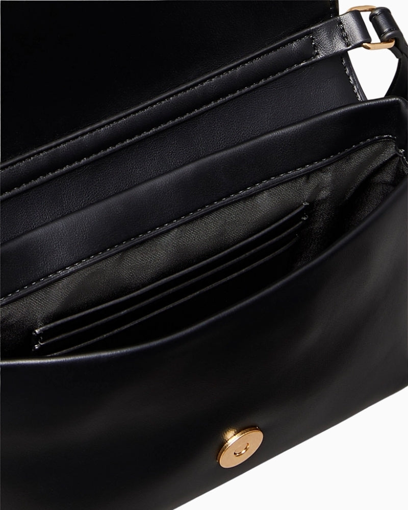 Top view of CK bag with open flap and card slot interior