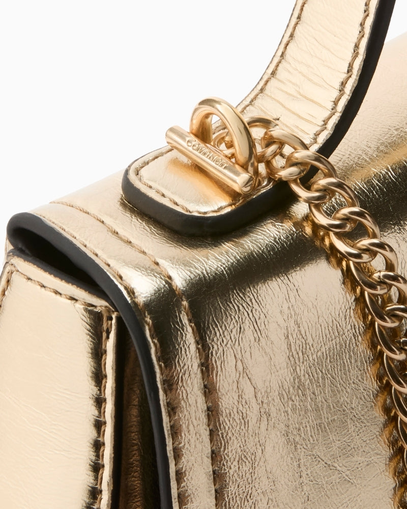 Calvin Klein gold metallic bag chain strap and side detail – Áines Boutique