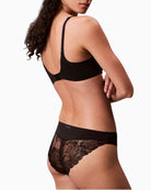 Side view of Calvin Klein briefs showing flattering mid waist fit