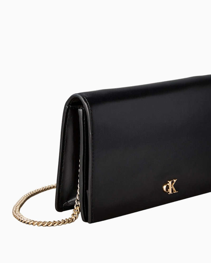 Side view of structured faux leather wallet with flap closure