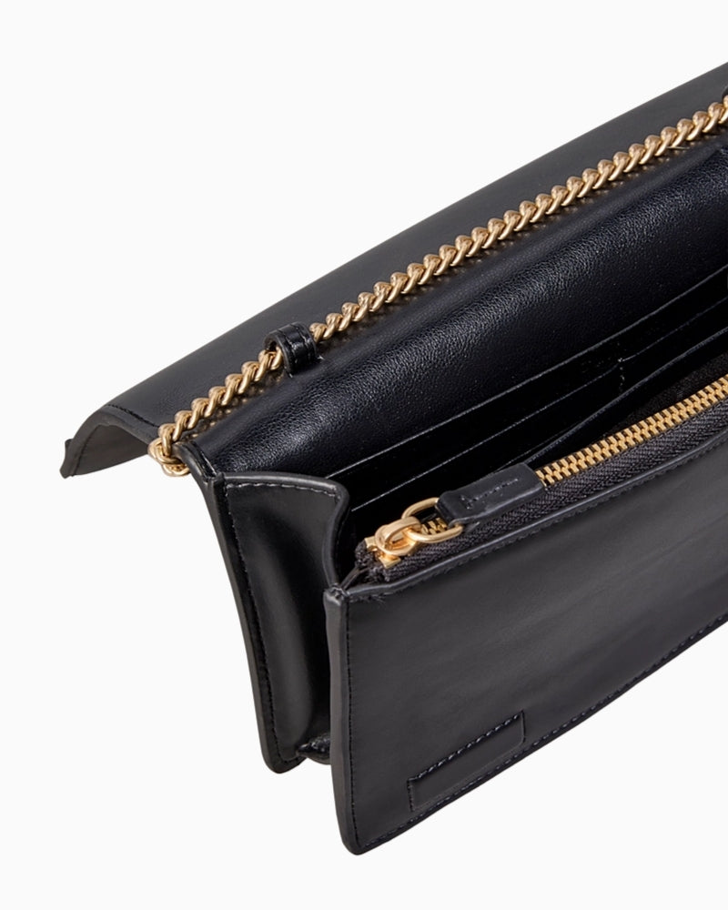 Detail of gold chainlink strap and CK logo hardware