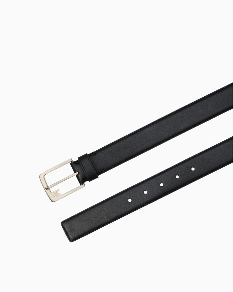 Calvin Klein black belt angled view showing shiny strap – Áines Boutique