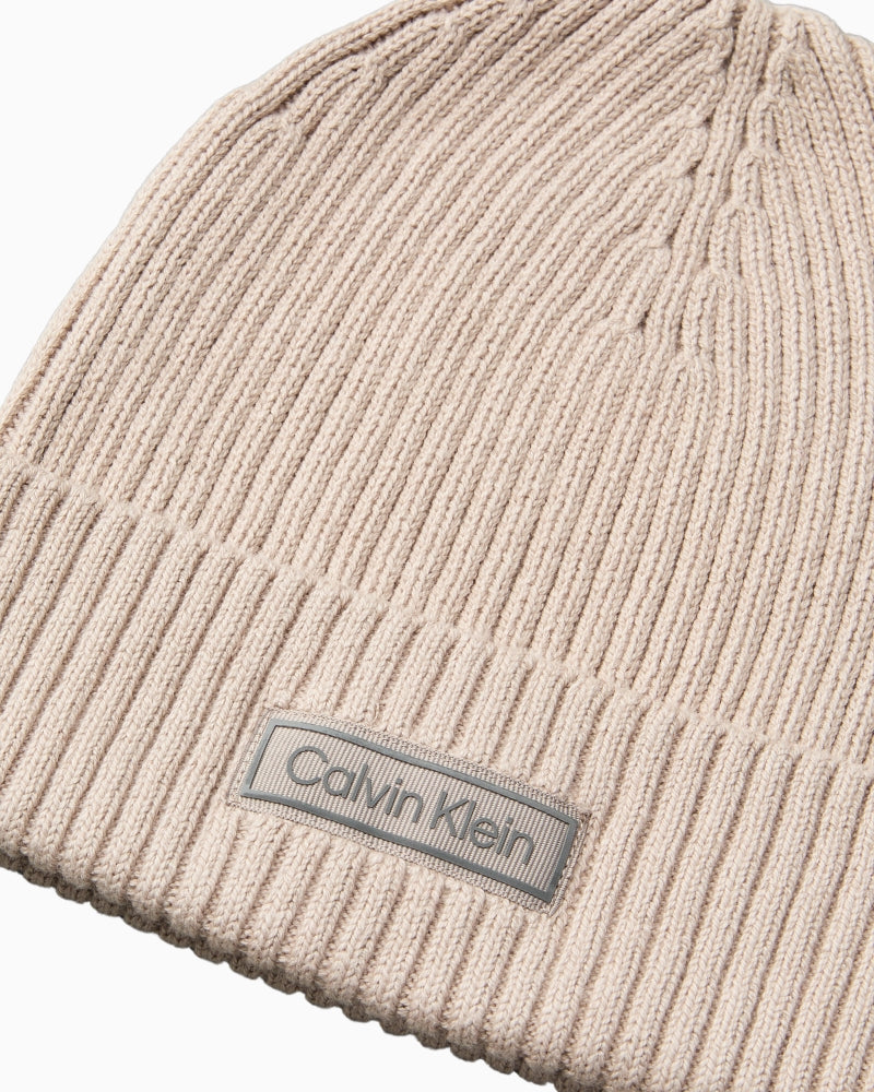 Close-up of CK patch and rib knit texture on beanie