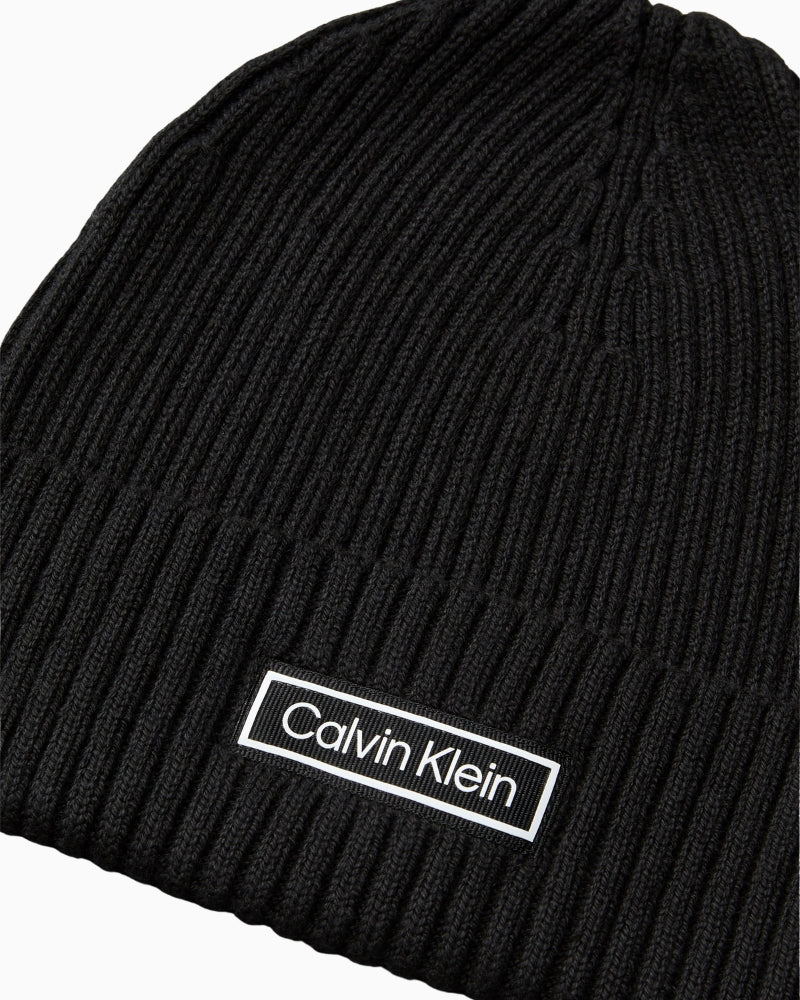 Close-up of CK patch and rib knit texture on beanie