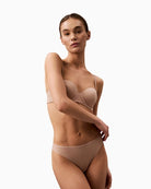 Front view of Calvin Klein bikini briefs showing medium-rise fit and lightweight fabric
