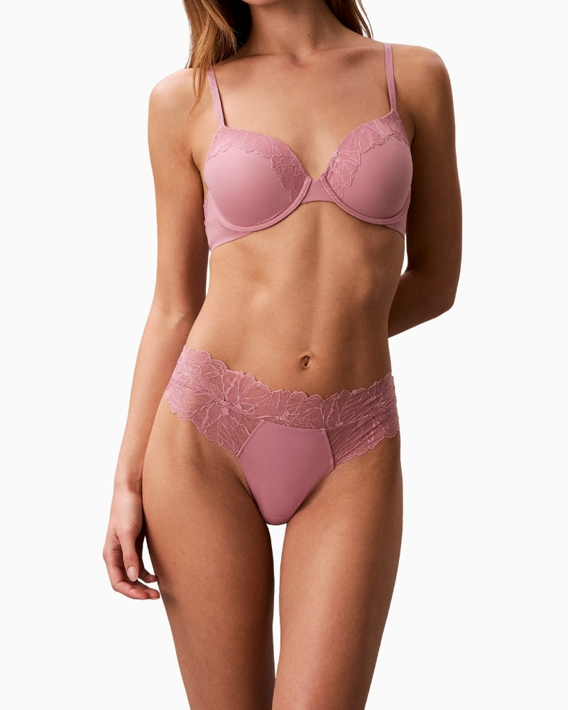 Pink Calvin Klein lace thong angled front view showing bonded edges – Áines Boutique