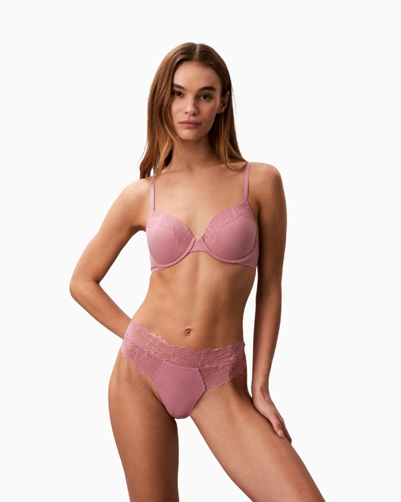 Pink Calvin Klein lace thong angled front view showing bonded edges – Áines Boutique