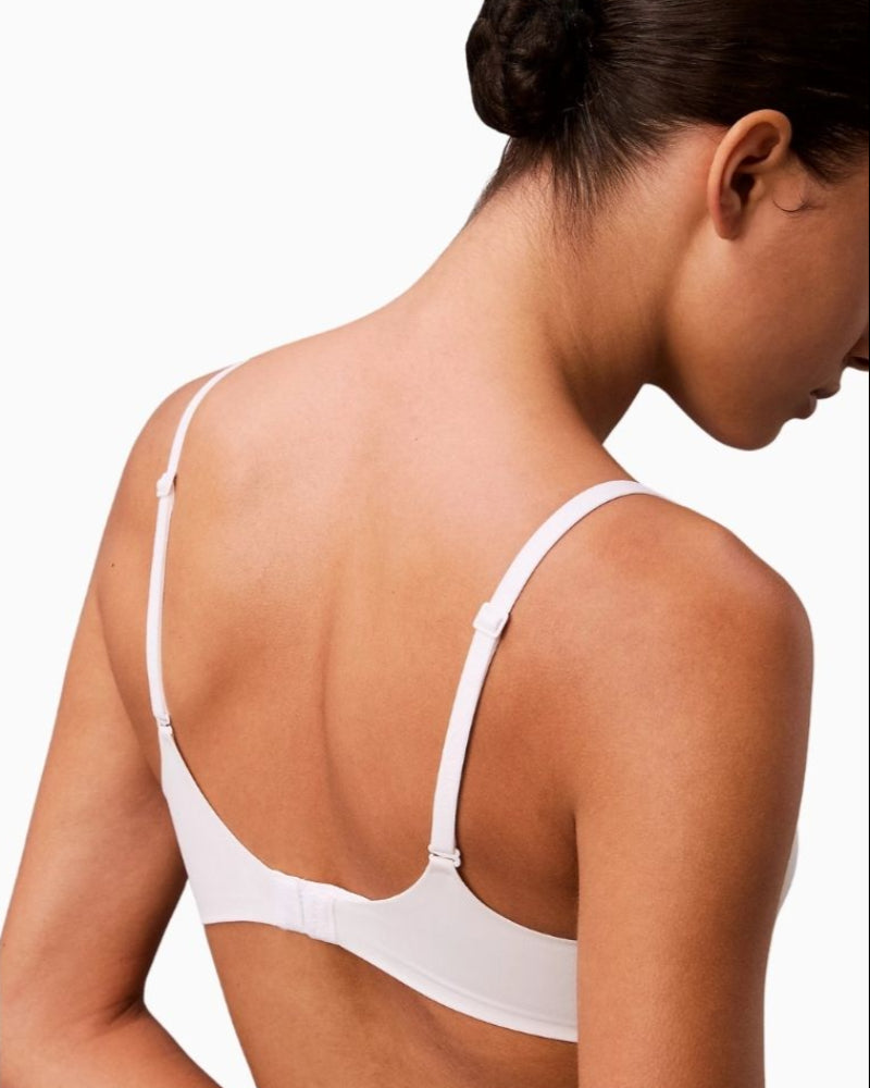 Close-up of Calvin Klein plunge bra with padded cups and underwire support