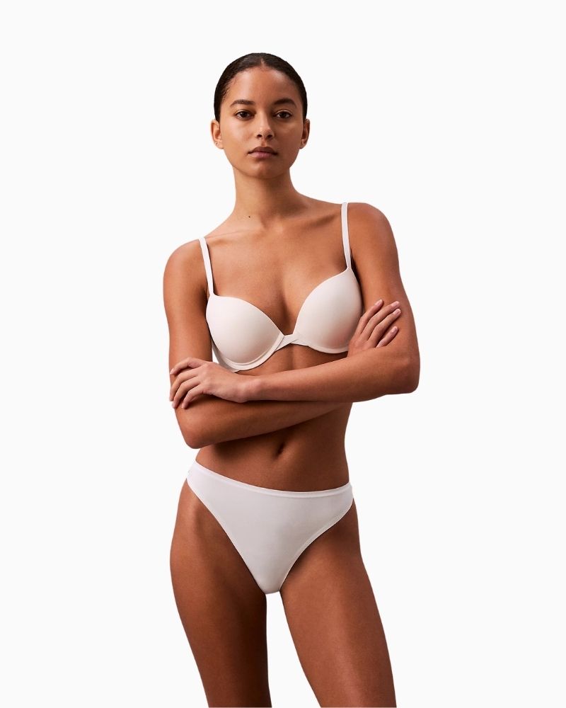 Calvin Klein Perfectly Fit Thong in white with tonal logo waistband and soft microfiber fabric