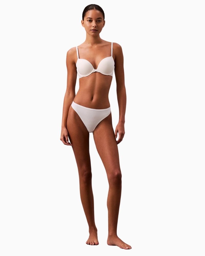 Calvin Klein Perfectly Fit Thong in white with tonal logo waistband and soft microfiber fabric