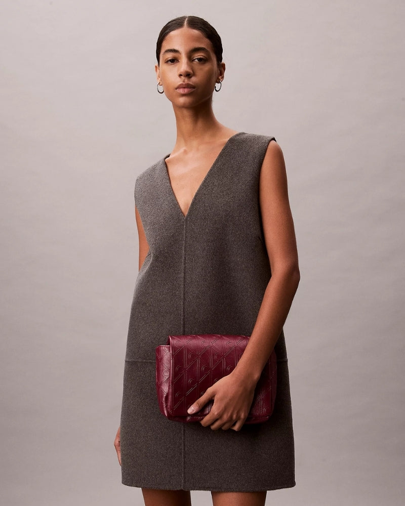 Calvin Klein Puffer Emblem Logo Flap Crossbody Bag worn crossbody – Áines Boutique