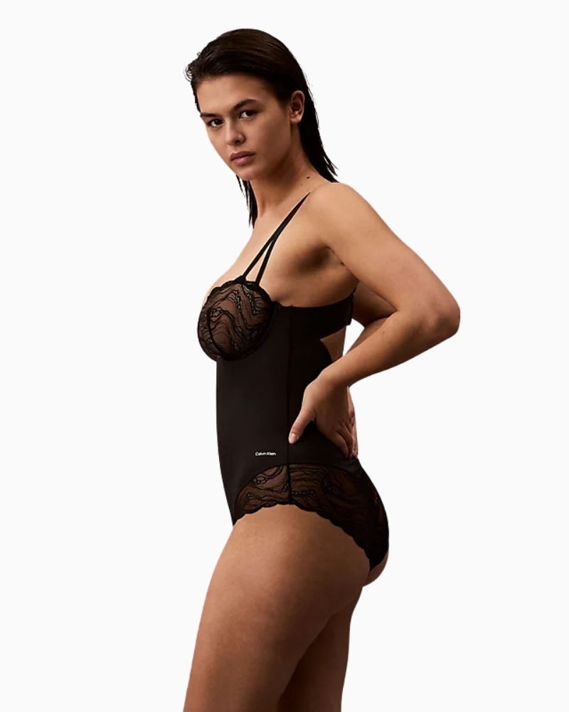Side view of Calvin Klein bodysuit showing convertible straps and lace detail