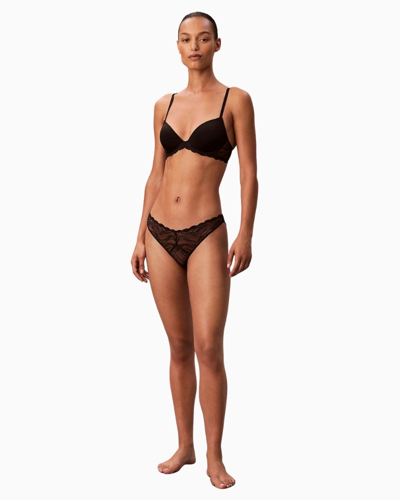 Front view of Sensual Stretch Lace bra in nude with metal logo detail