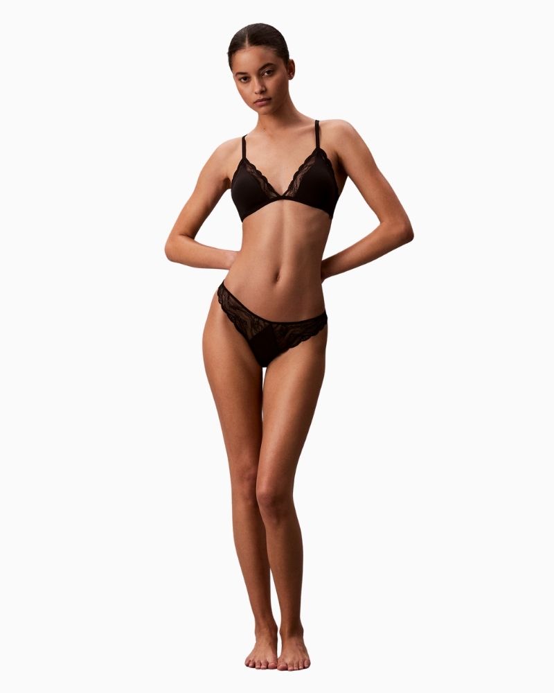 Calvin Klein lace thong with scalloped trim, cut-out back, and logo detail