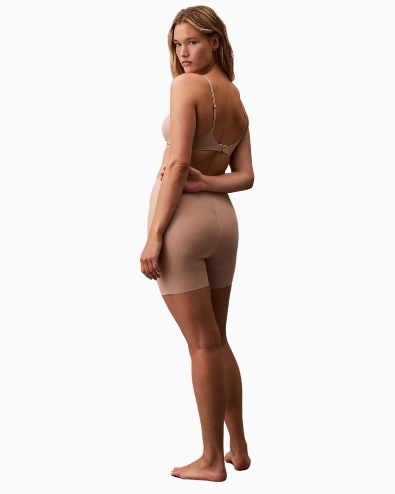 Close-up of Calvin Klein sculpting mesh panels for targeted tummy and thigh control