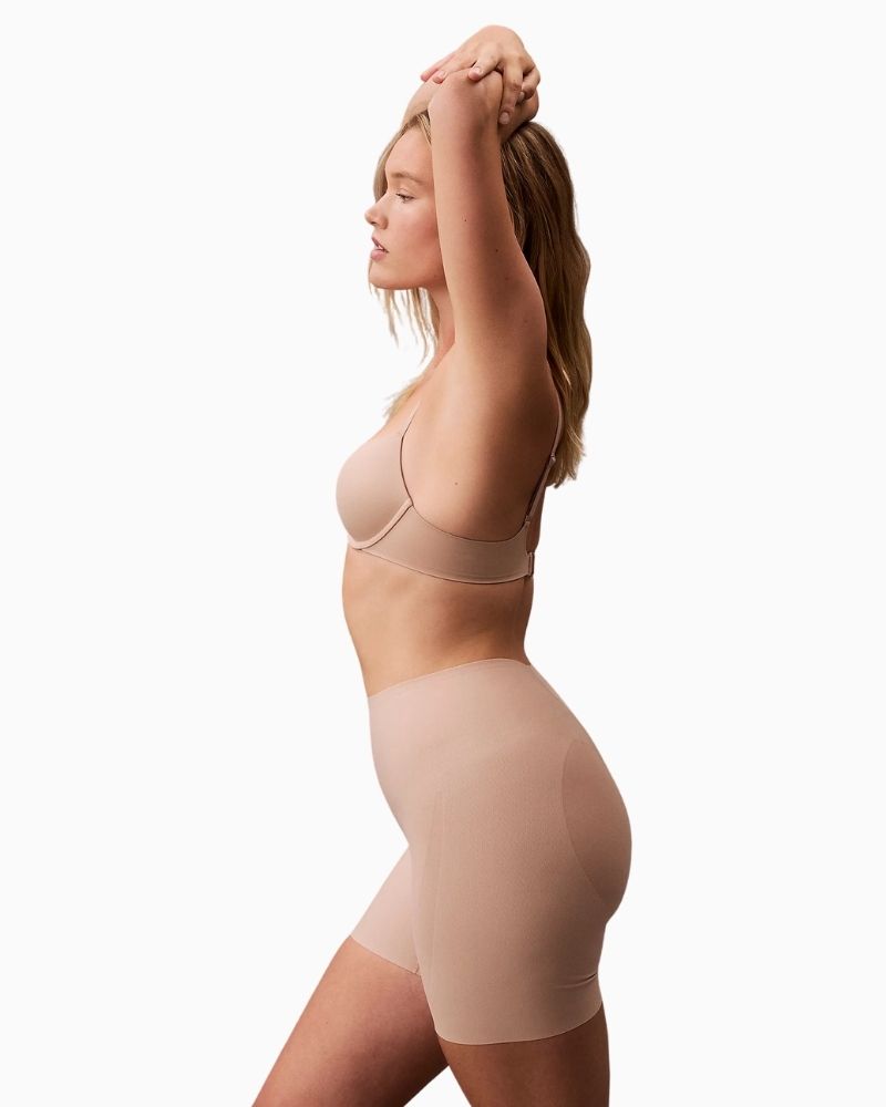 Side view of Calvin Klein sculpting mesh panels for targeted tummy and thigh control