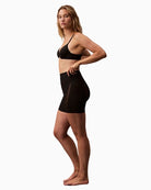 Side view of Calvin Klein shapewear shorts showing sculpting mesh panels